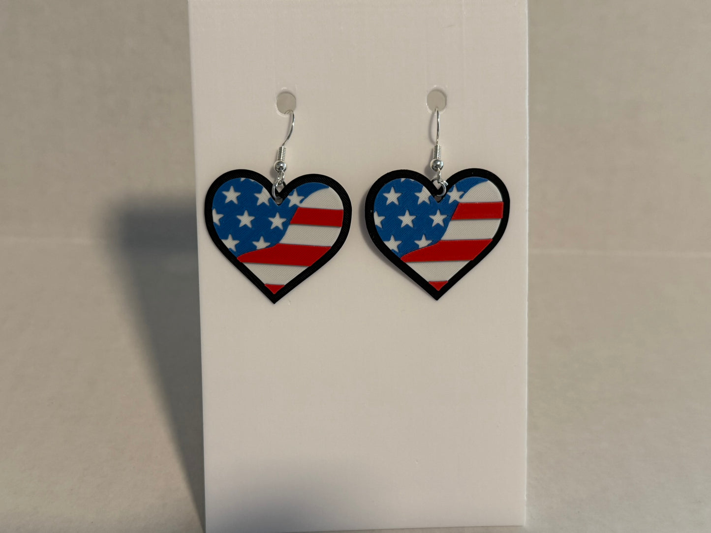 Sweetheart Patriot: 3D Printed Stars & Stripes Heart Earrings - Black border
